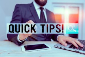 Man's finger points to Quick Tips