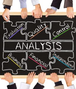 Hands holding puzzle pieces for analysis