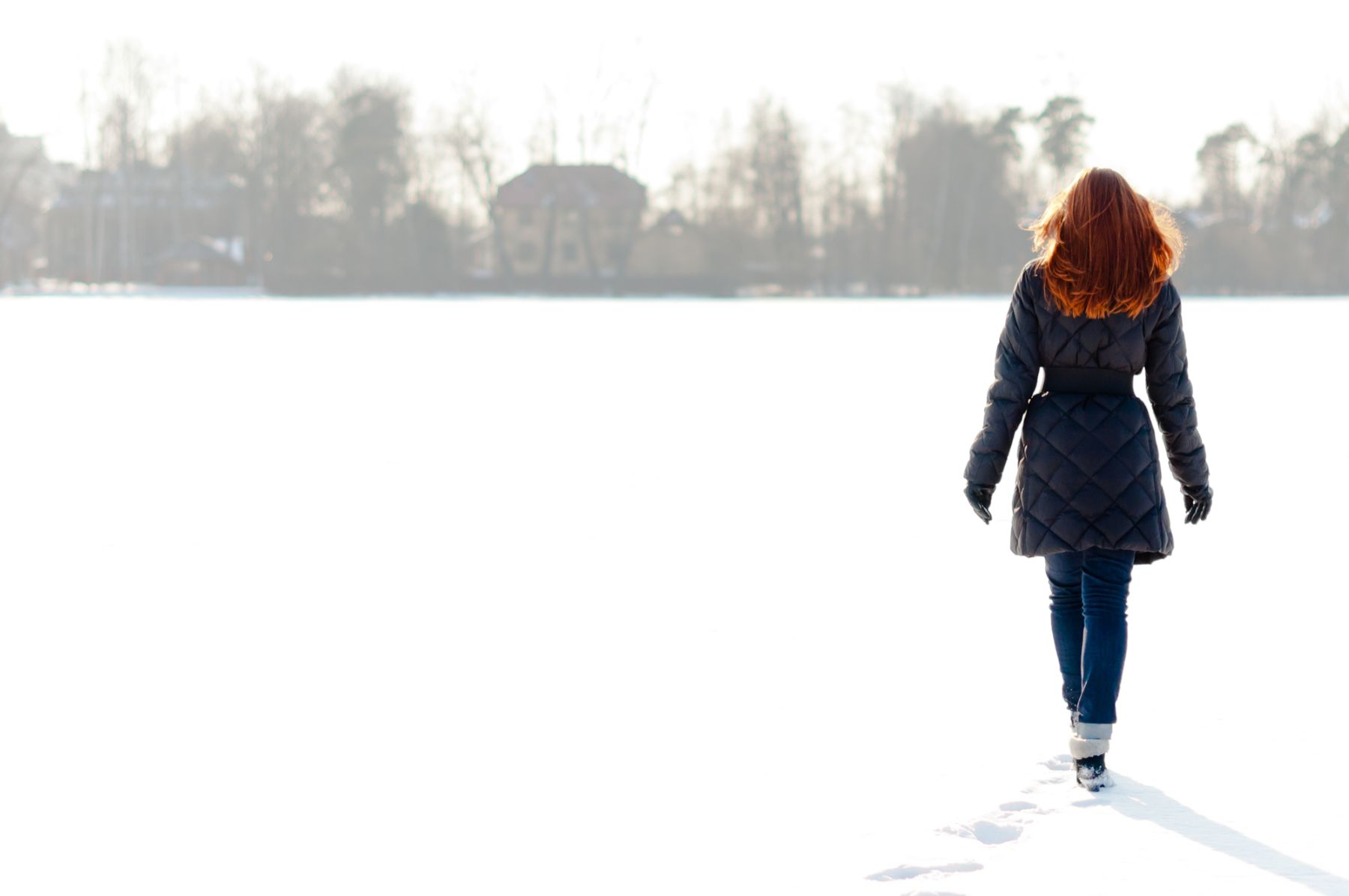 Woman walking in the snow
