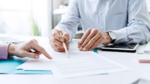 People discussing paperwork
