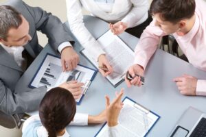 Coworkers discussing reports