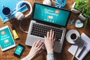 Hands typing on laptop for online shopping