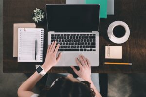 Hands typing on keyboard