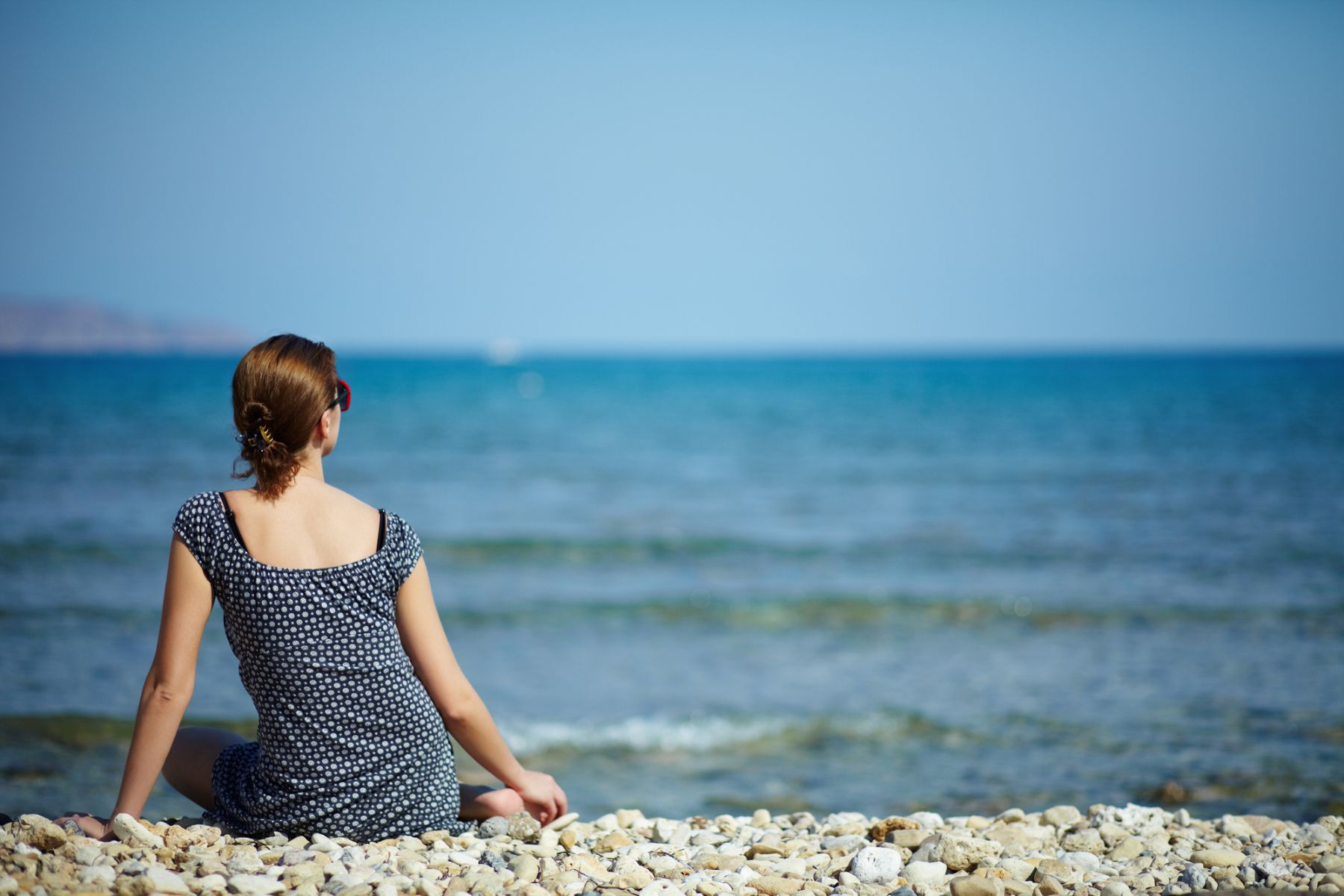 woman sitting a the beach