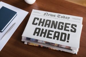 Newspaper on desk that says, "News Ahead!"