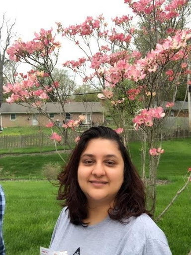 girl with flower tree behind her