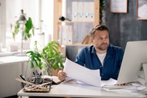 project manager looking at report