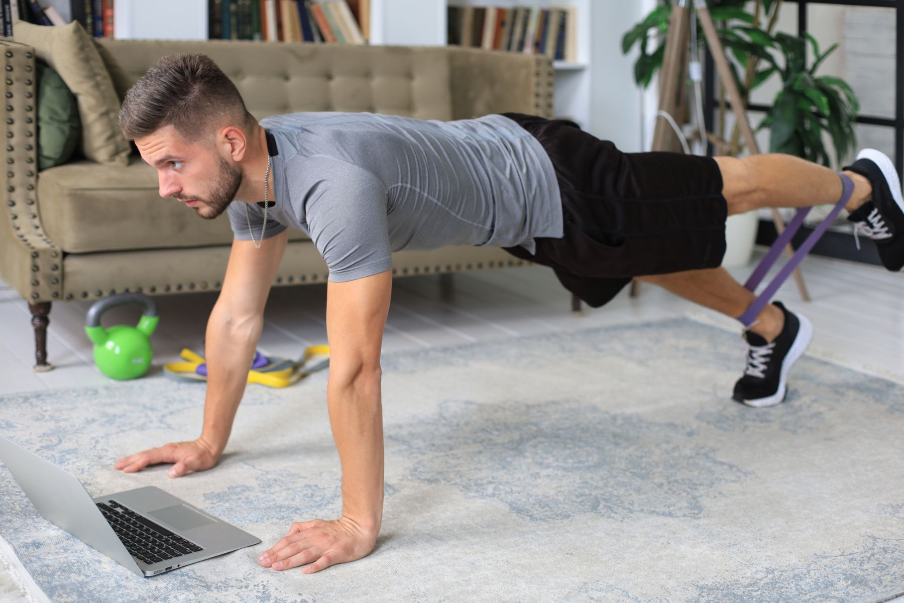 man working out while on computer
