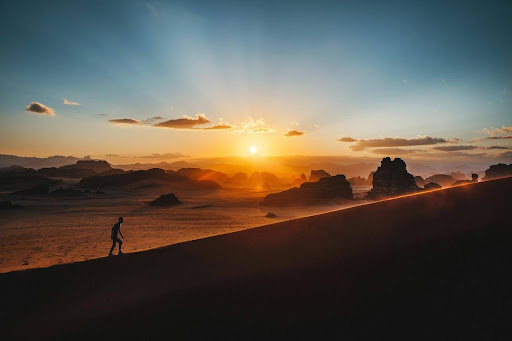 someone climbing up a hill